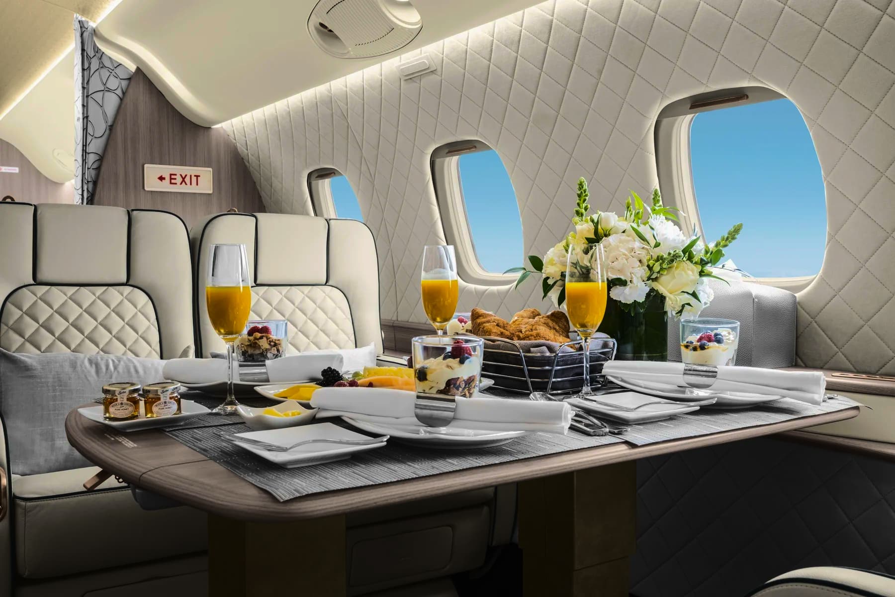 Footer background image of a plane cabin with a view of two seats